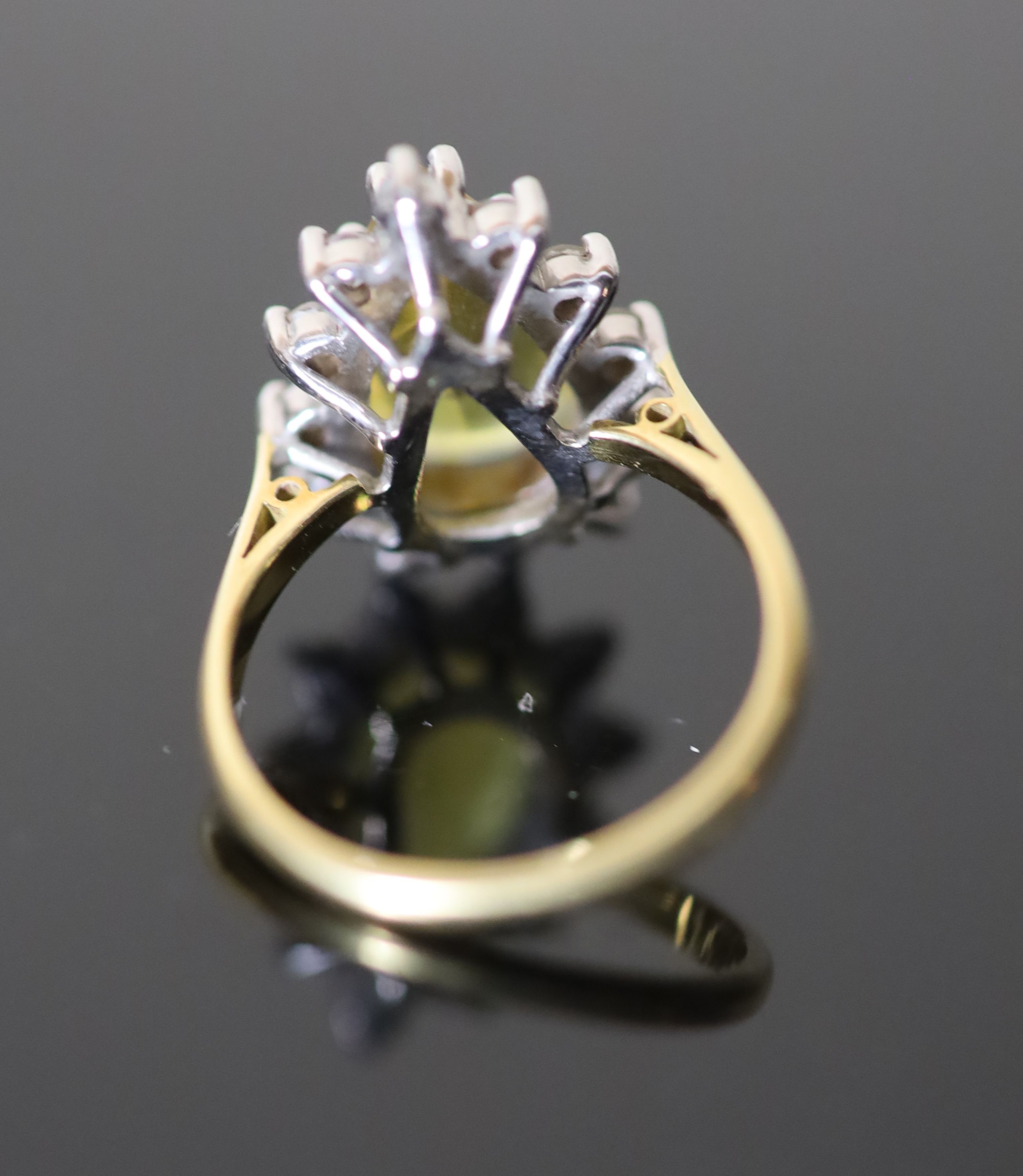 A modern 18ct gold, pear shaped yellow tourmaline and diamond set cluster dress ring,